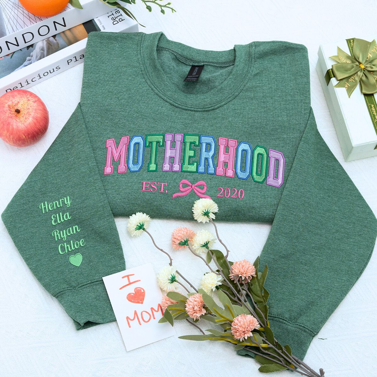 Motherhood Sweatshirt or Hoodie with Coquette Bow and Kids Names on Sleeve, Custom Embroidered Gift for Mother's Day