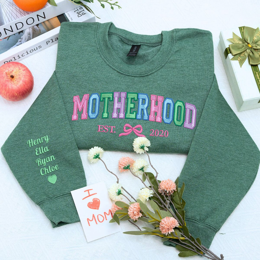 Motherhood Sweatshirt or Hoodie with Coquette Bow and Kids Names on Sleeve, Custom Embroidered Gift for Mother's Day