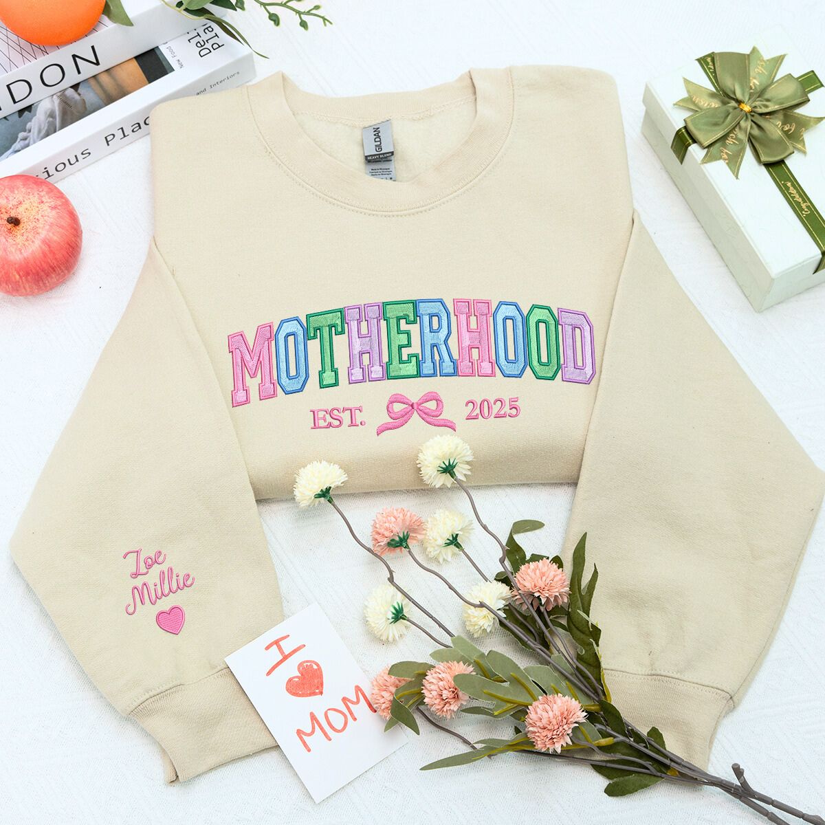 Motherhood Sweatshirt or Hoodie with Coquette Bow and Kids Names on Sleeve, Custom Embroidered Gift for Mother's Day